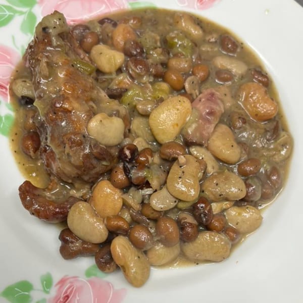 Chef Daddy's southern-style butter beans and lima beans with a piece of chicken in a creamy sauce.