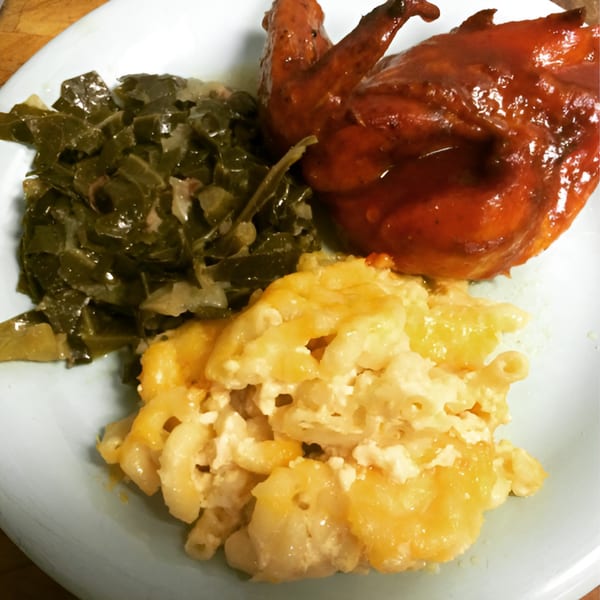 Chef Daddy's southern meal with BBQ chicken, collard greens, and macaroni and cheese.