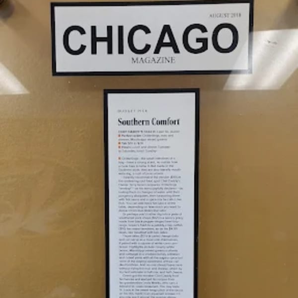 A framed "Chicago Magazine" article titled "Southern Comfort" about Chef Daddy's southern cuisine.